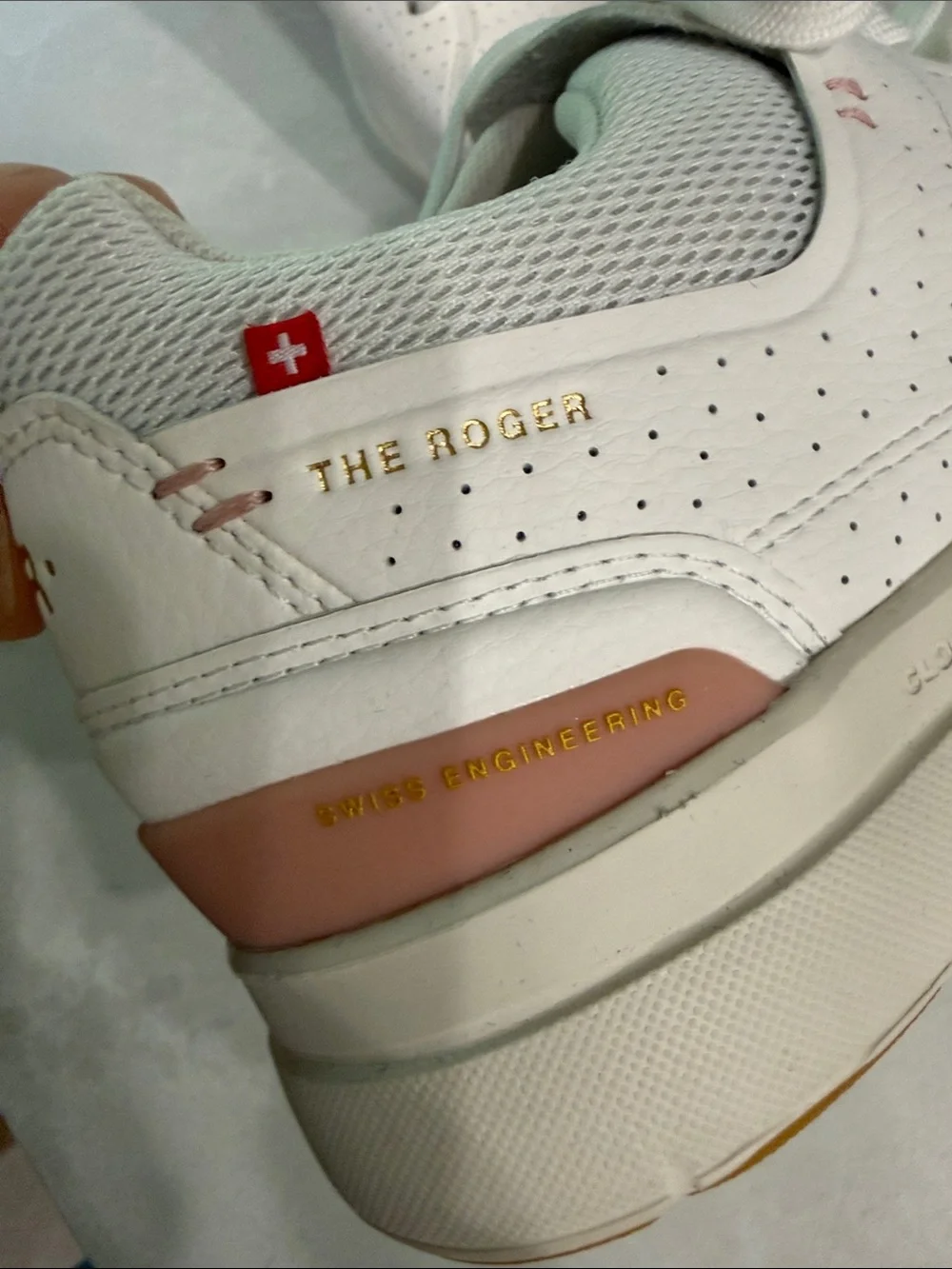 On Cloud . The Roger  Women's Perforated Leather Sneakers